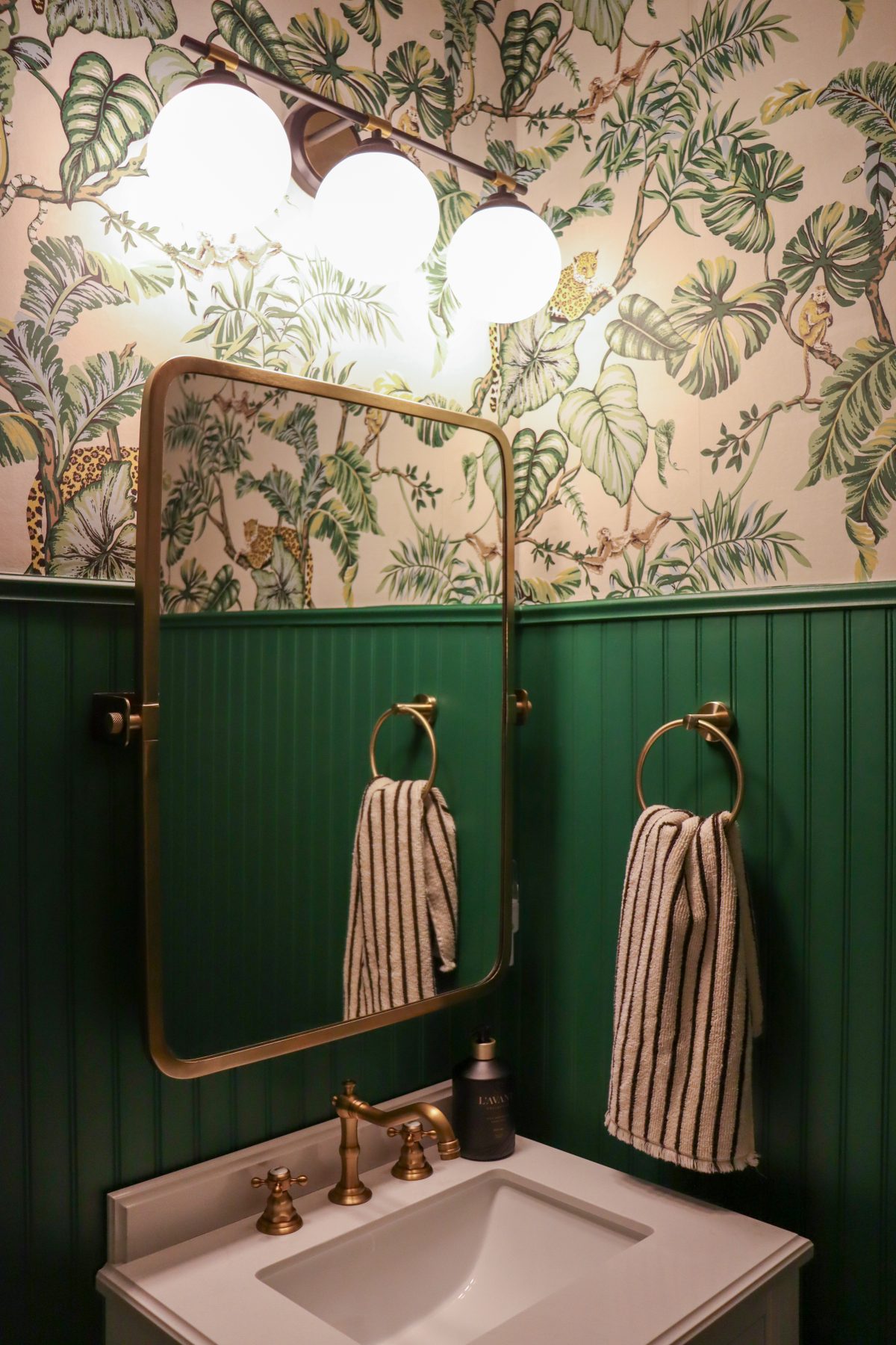 builder grade upgrade powder room with York Jungle Cat Wallpaper and green sherwin william paint